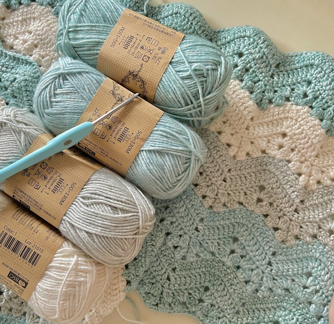 Crochet baby blanket and amigurumi toy in nursery setting